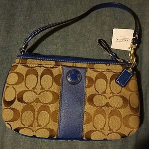 Brand new Coach large wristlet in Colbalt/Kahki